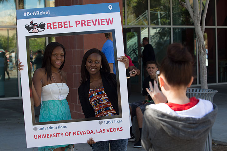 Students posing for a photograph during Rebel Preview event.